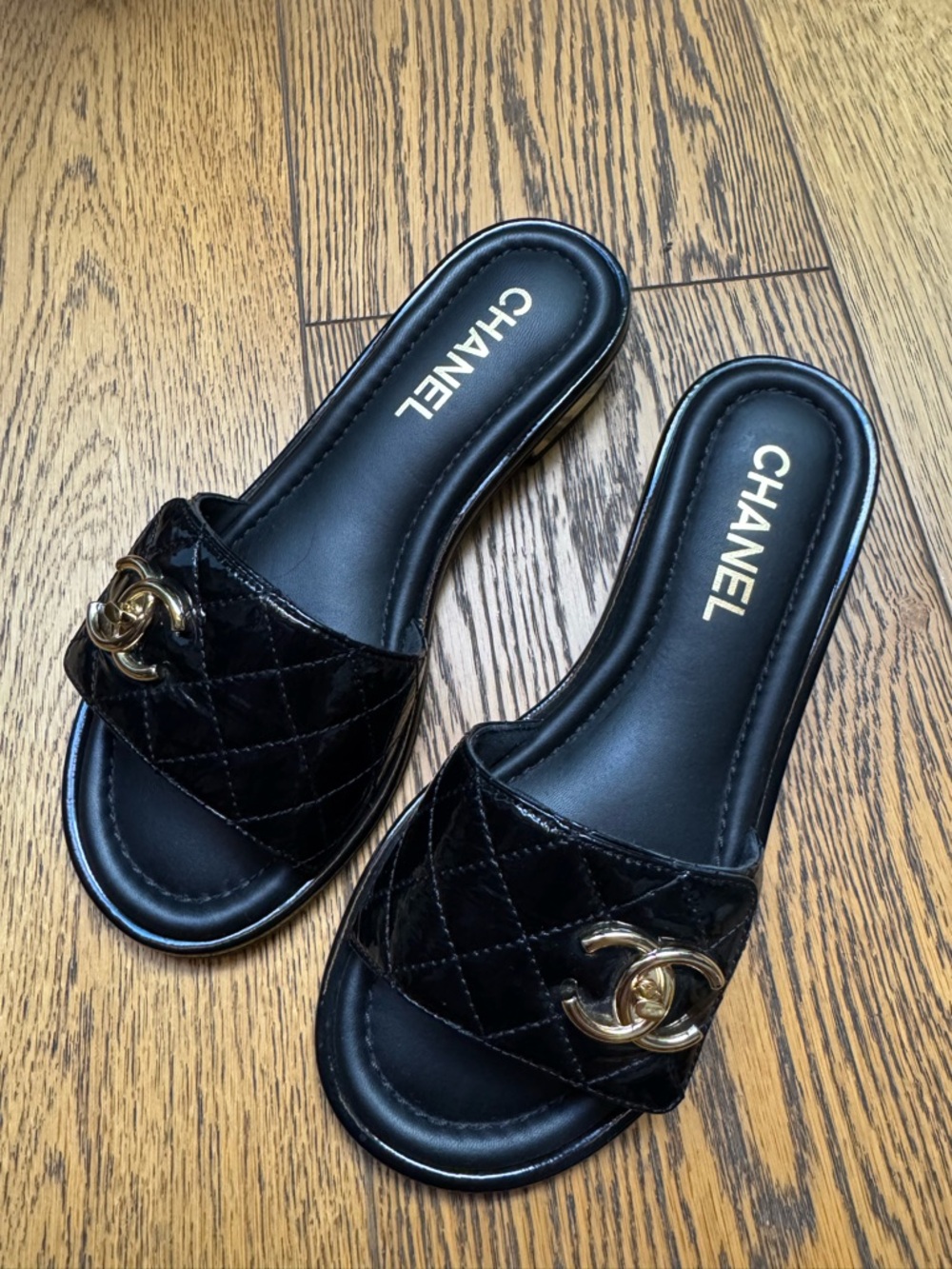 CHANEL Black Quilted Patent Leather Slide Mules with Gold CC Hardware